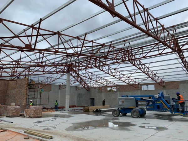 Waterstone Village Shopping Mall in Somerset West in South Africa. Busy with a commercial roof steel project. Industrial & Commercial Steel Structures.